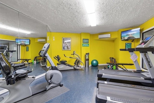 gym featuring a textured ceiling and an AC wall unit