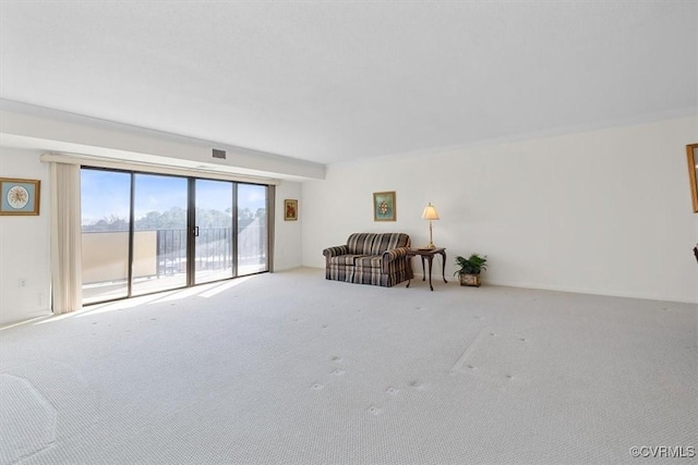 unfurnished living room featuring light carpet