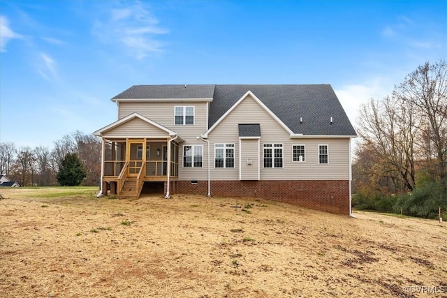 rear view of house with a sunroom