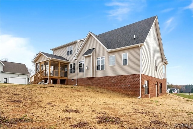 back of property featuring a sunroom