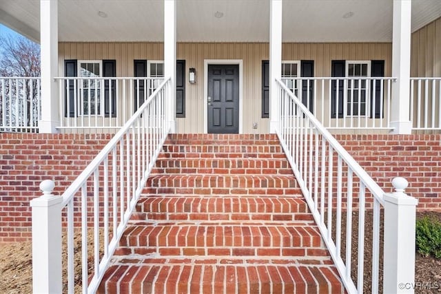 doorway to property featuring a porch