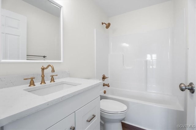 full bathroom with toilet, vanity, and bathing tub / shower combination