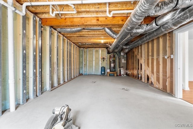 basement featuring heating unit and gas water heater