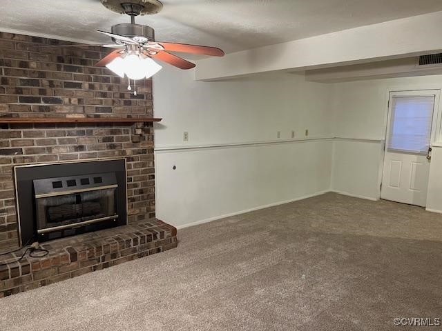 unfurnished living room featuring ceiling fan and carpet flooring