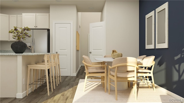 dining space featuring light wood-type flooring