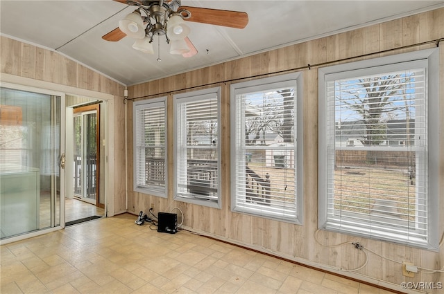 interior space with lofted ceiling, a healthy amount of sunlight, and ceiling fan