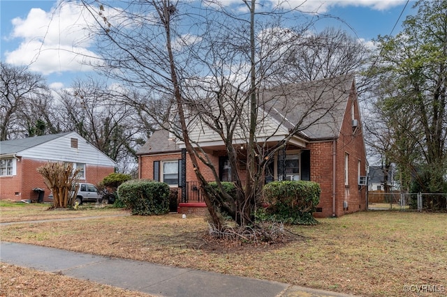 bungalow-style home featuring a front lawn