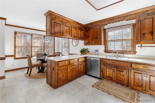 kitchen with sink, ornamental molding, kitchen peninsula, and dishwasher