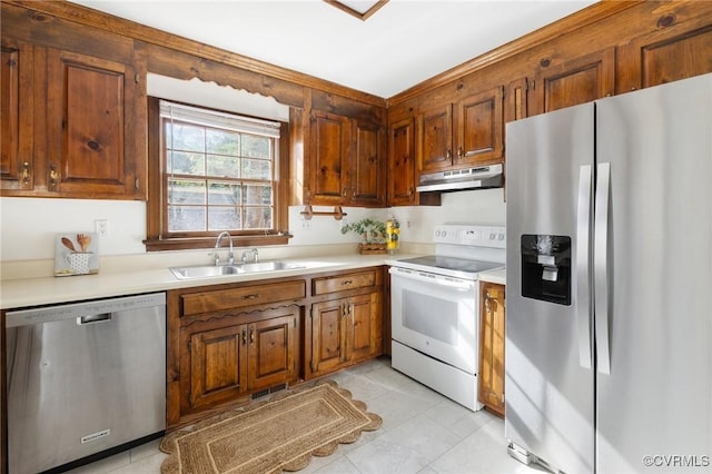 kitchen with sink and appliances with stainless steel finishes