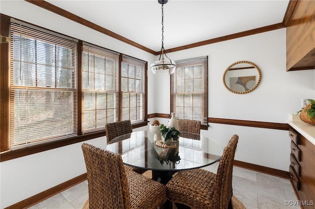 dining room featuring crown molding