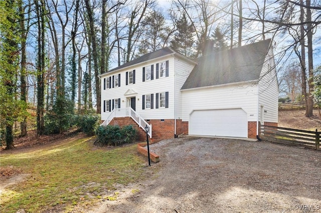 colonial home featuring a garage