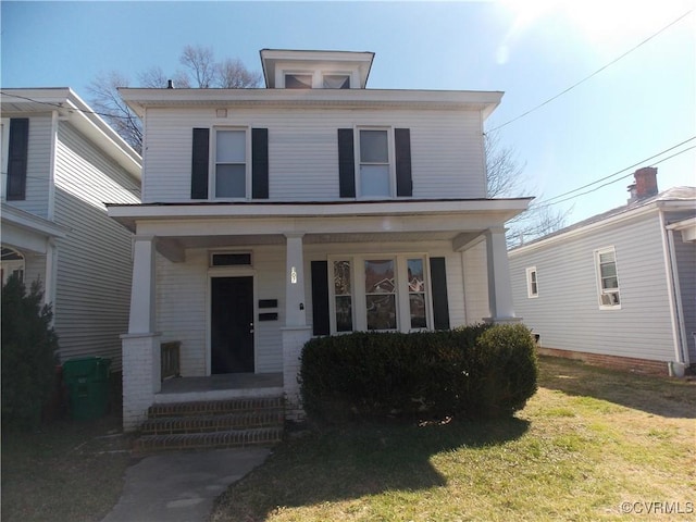 view of front of house with a front lawn and covered porch