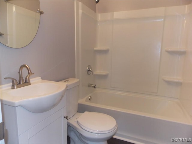 full bathroom featuring toilet,  shower combination, and vanity