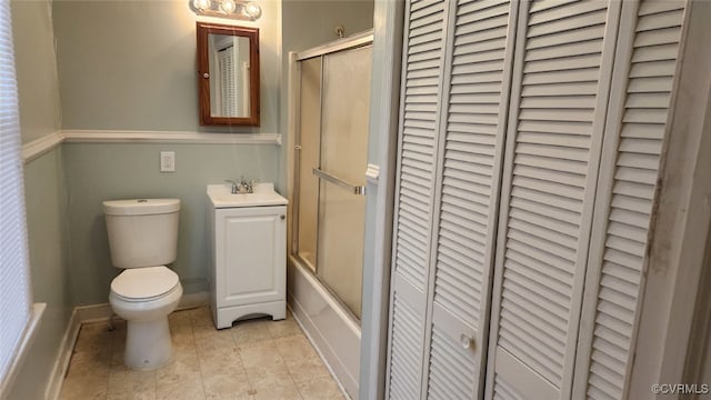 full bathroom with toilet, tile patterned flooring, enclosed tub / shower combo, and vanity