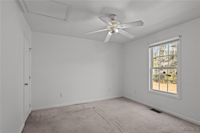 carpeted spare room with ceiling fan