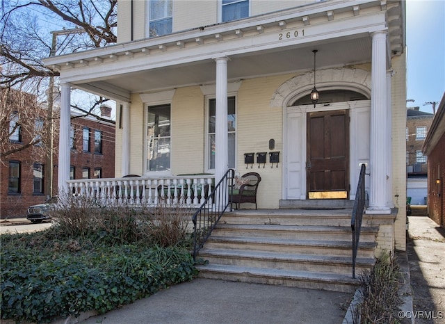 entrance to property featuring a porch