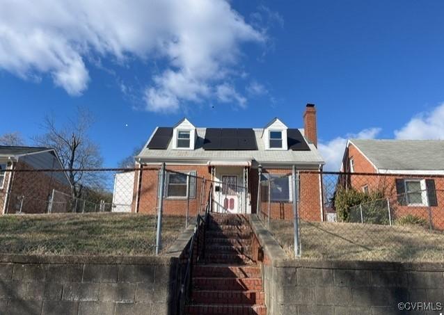 view of front of home with solar panels and a porch