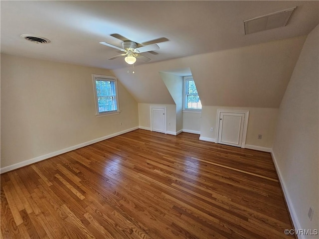 bonus room featuring ceiling fan, hardwood / wood-style floors, and lofted ceiling