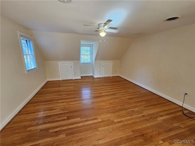 additional living space with ceiling fan, lofted ceiling, and light hardwood / wood-style floors