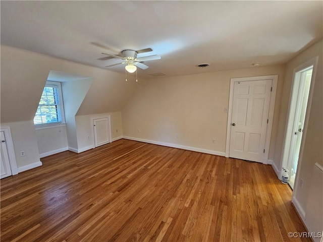 additional living space featuring ceiling fan, lofted ceiling, and hardwood / wood-style floors