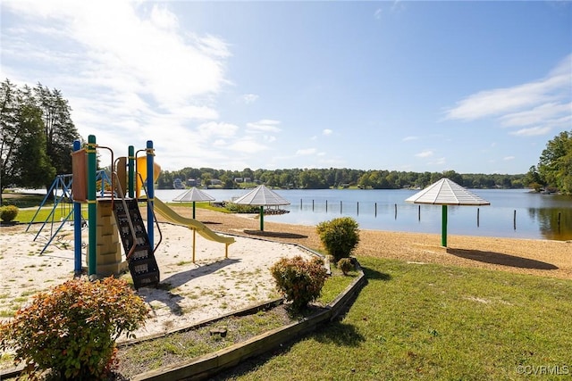 view of playground with a water view and a yard