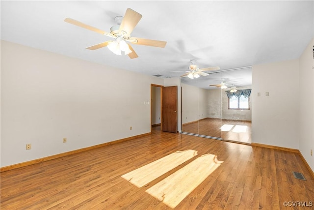 spare room with hardwood / wood-style floors