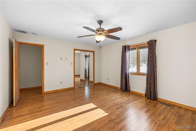 unfurnished bedroom with light hardwood / wood-style floors and ceiling fan