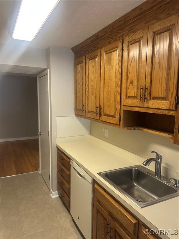 kitchen with white dishwasher and sink