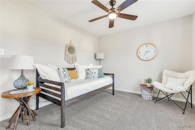 living area with ceiling fan and carpet floors