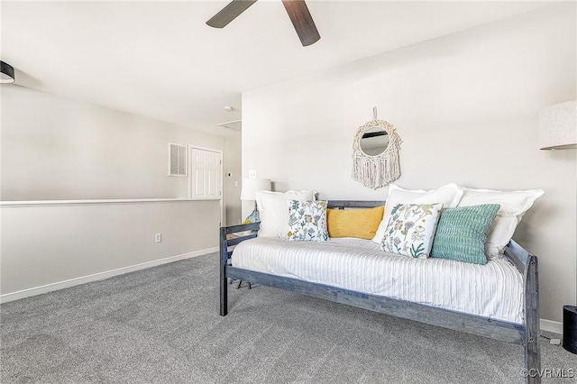 living area featuring ceiling fan and carpet