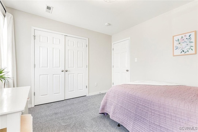 carpeted bedroom featuring a closet