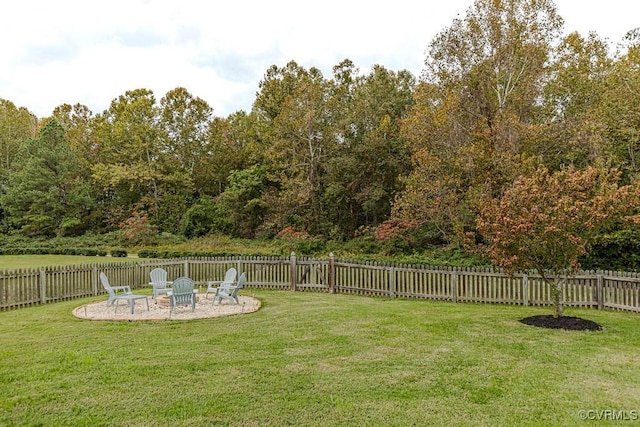 view of yard with a fire pit