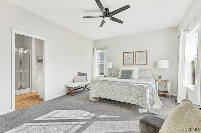 carpeted bedroom with ensuite bath and ceiling fan