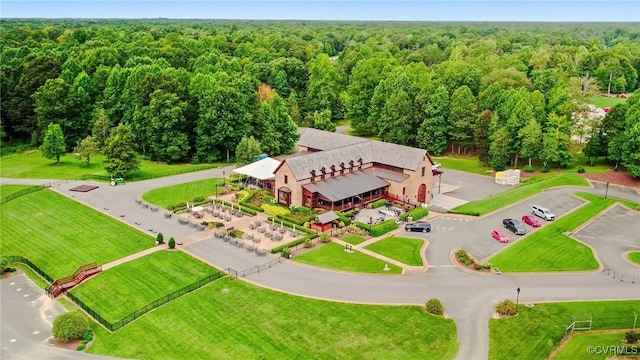 drone / aerial view featuring a forest view