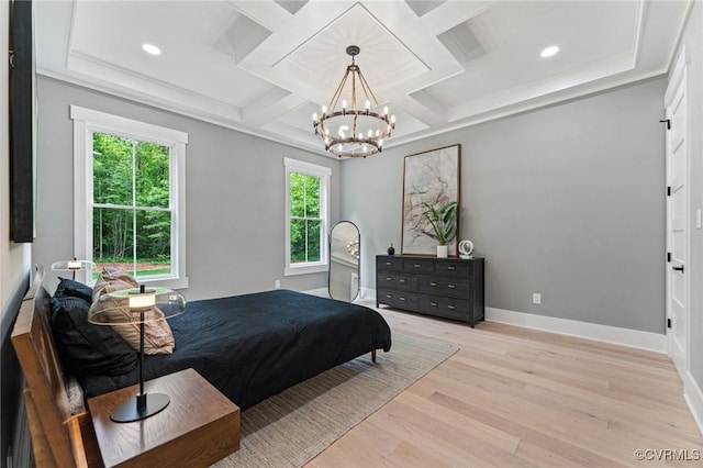bedroom featuring a notable chandelier, light wood-type flooring, baseboards, and coffered ceiling