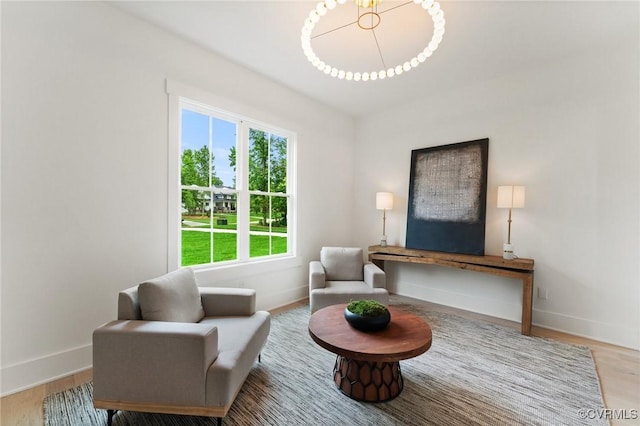 living area with wood finished floors and baseboards