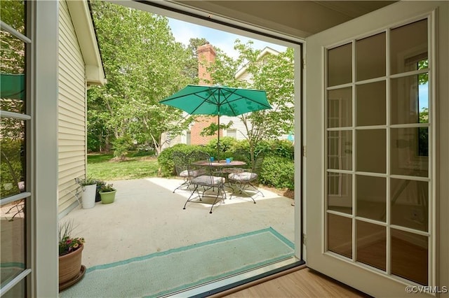 doorway to outside with hardwood / wood-style flooring