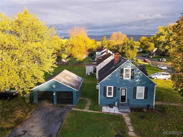 view of front facade featuring a front yard and a carport