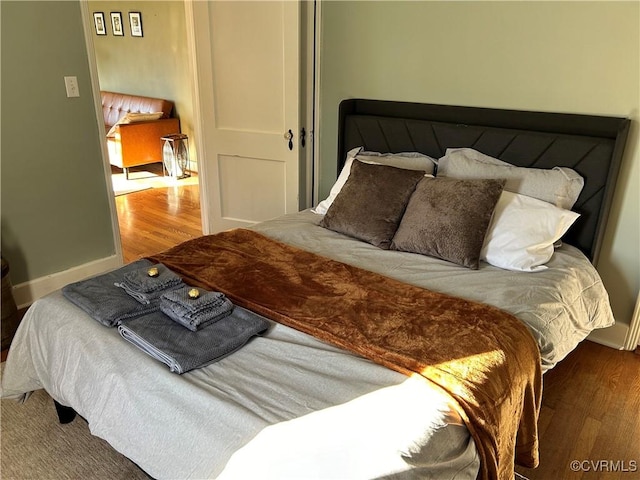 bedroom with wood-type flooring