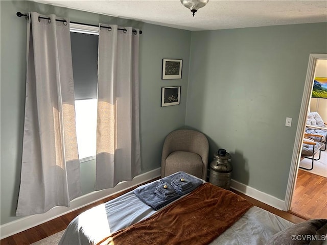 bedroom featuring hardwood / wood-style flooring