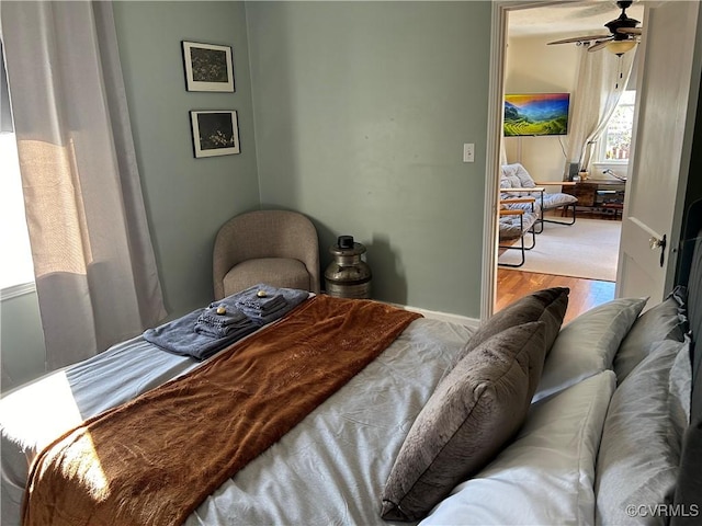 bedroom featuring light wood-type flooring and multiple windows