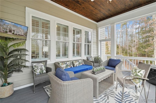 sunroom featuring wooden ceiling