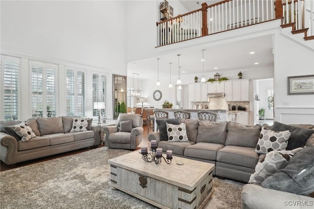 living room with a towering ceiling