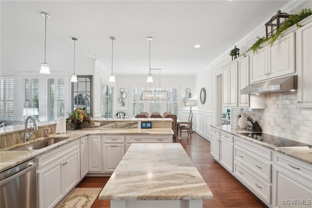 kitchen featuring sink, white cabinetry, a center island, stainless steel dishwasher, and black electric stovetop