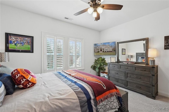 carpeted bedroom featuring ceiling fan