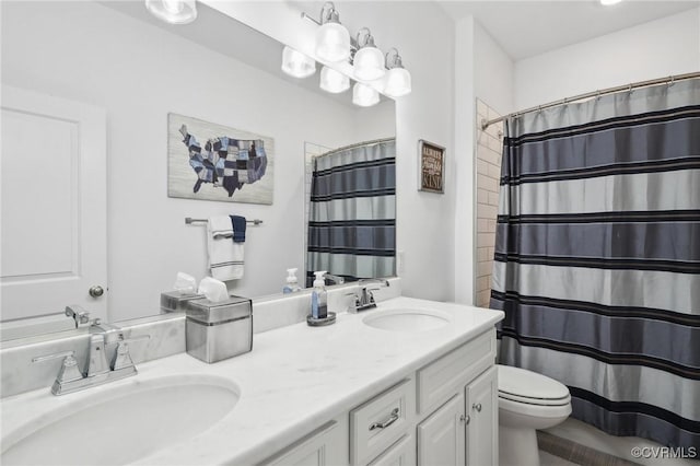 bathroom with a shower with curtain, vanity, and toilet