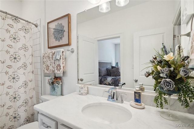 bathroom with vanity, toilet, and a shower with shower curtain