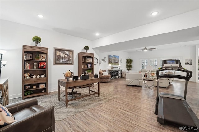 office with ceiling fan and light hardwood / wood-style floors