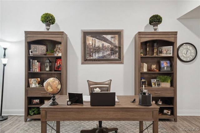 home office featuring hardwood / wood-style floors