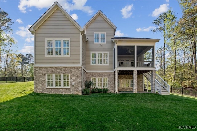 11513 Barrows Ridge Ln, Chesterfield, VA 23838 - rear view of house featuring stairway, fence, a yard, stone siding, and a sunroom
